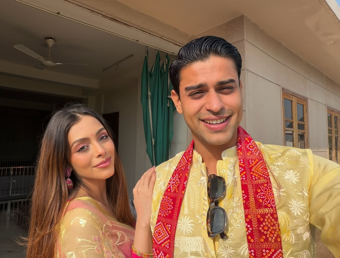 Sneha and Pratyush together in traditional yellow attire